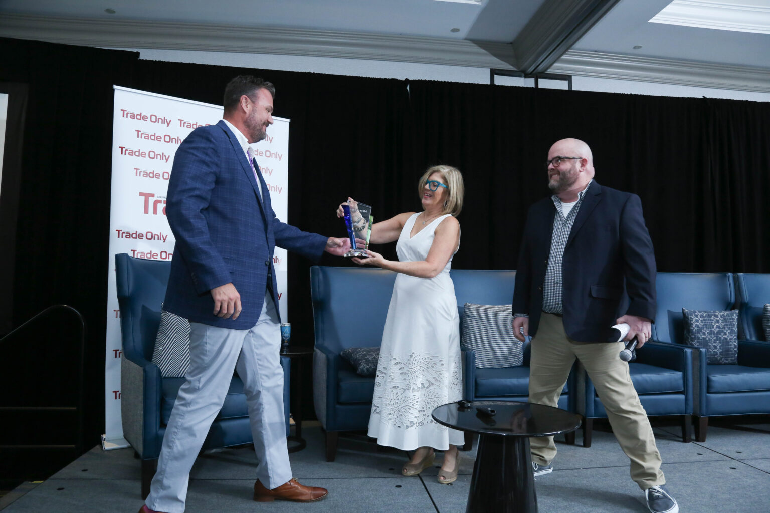 A Garmin representative is presented with the 2023 Most Innovative Company award from Soundings Trade Only