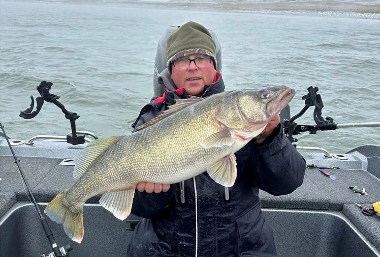 Aaron Schuck shows off his state record 16.8-pound walleye from South Dakota's Lake Oahe.